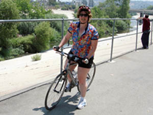Laurie riding by the LA River on bike path
